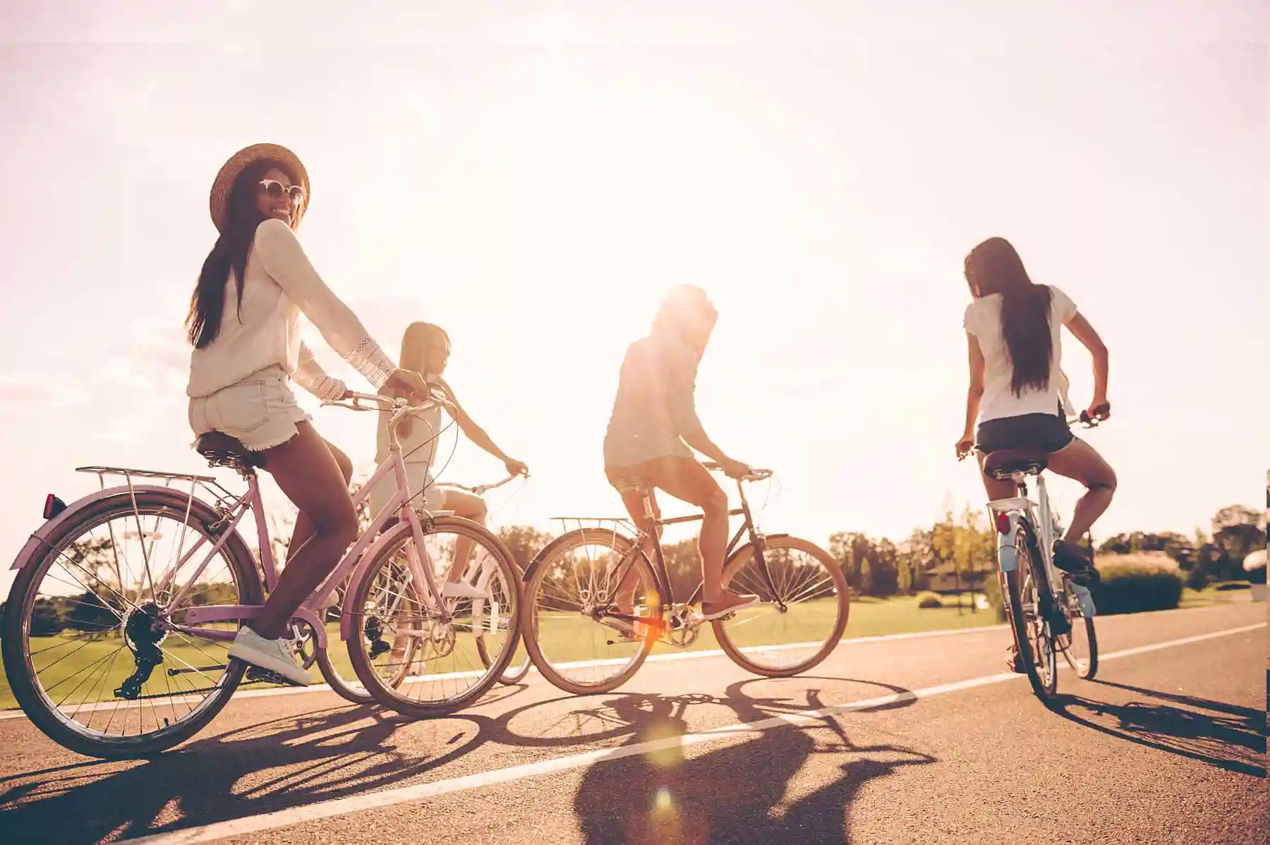 Four young people riding bikes