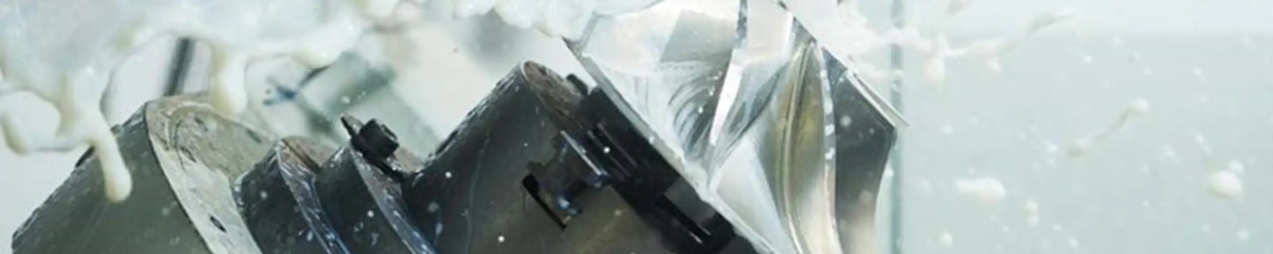 A 5-axis milling machine cuts a complex fan blade