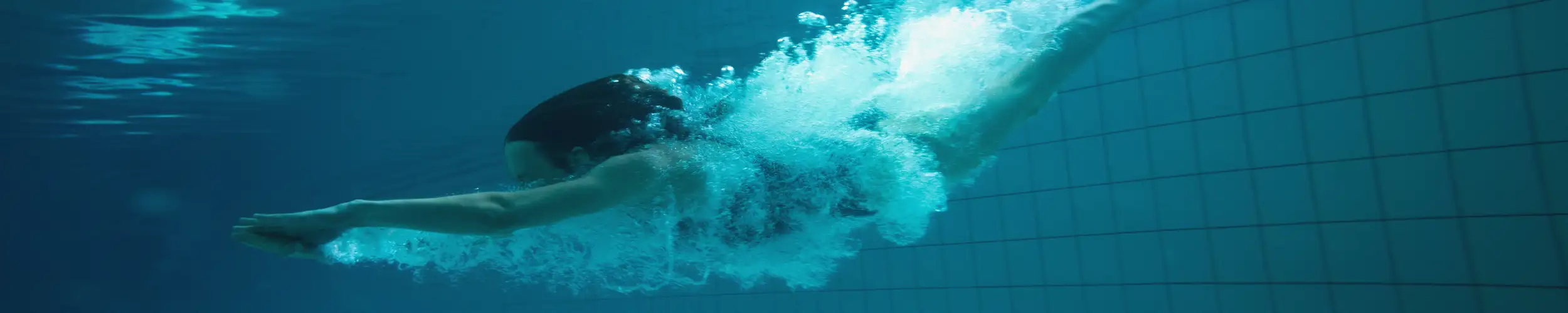 Woman diving into spa swimming pool