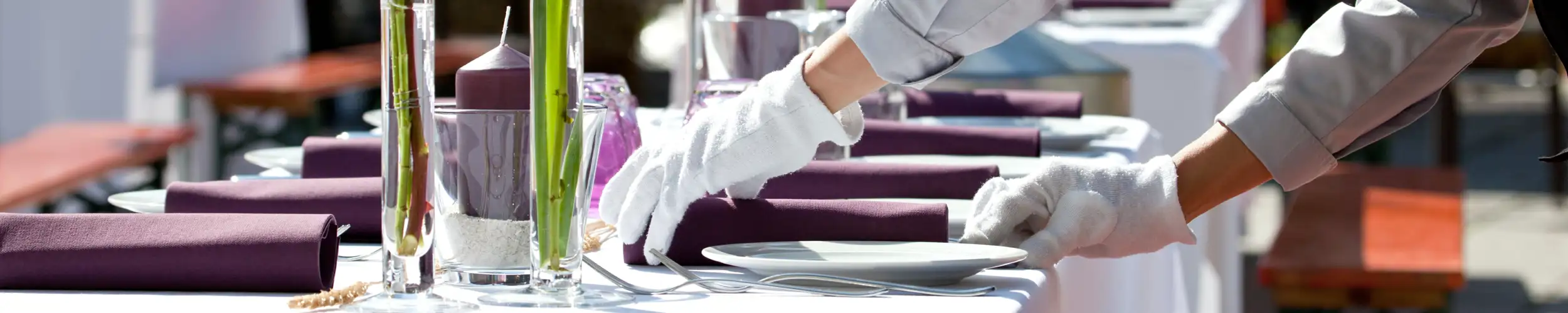 Waiter setting a table