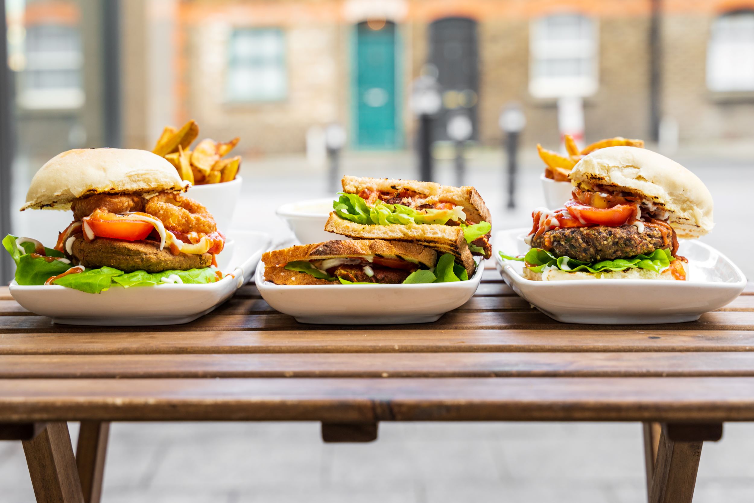 Close up of three sandwiches.