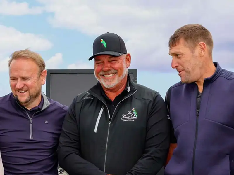 Golfer Darren Clarke posing for a picture with NFP employees.
