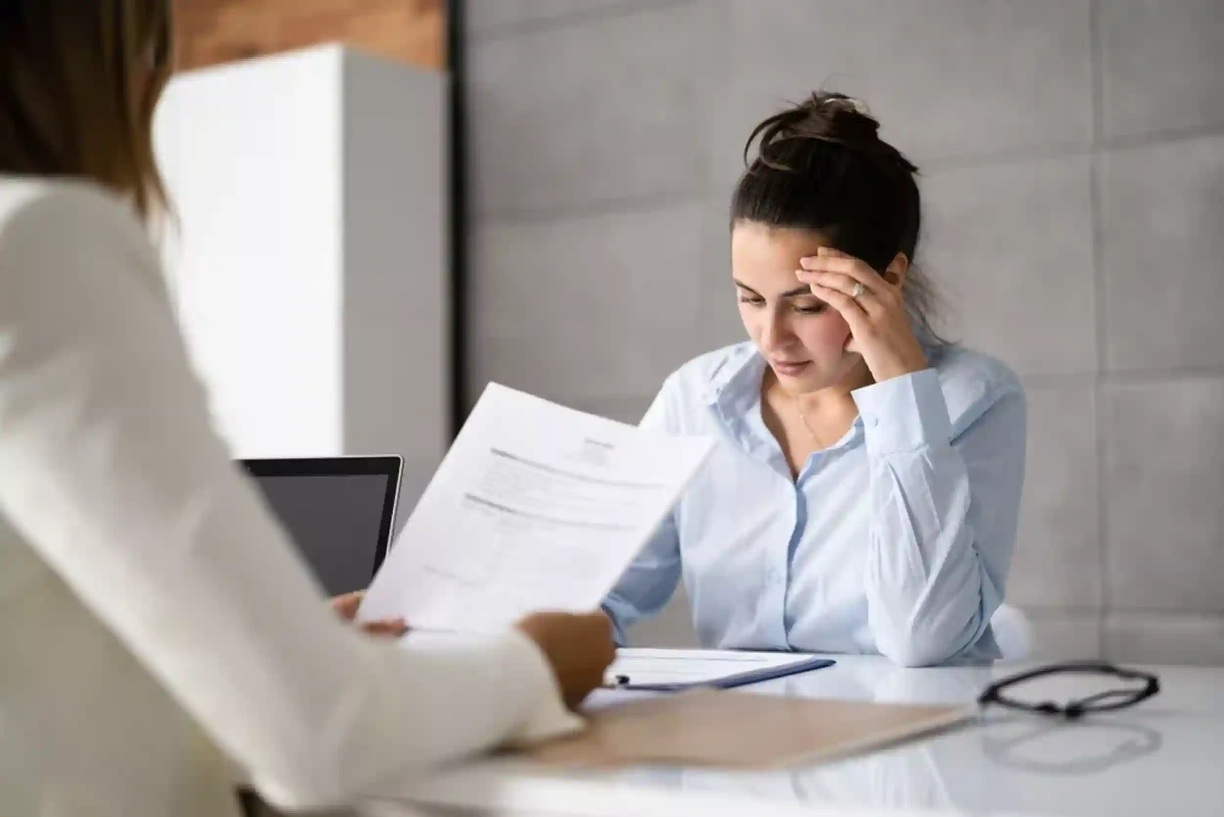 two women in a disciplinary procedure meeting